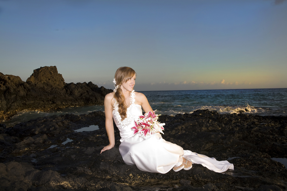 bride on rocks at Makena Cove Maui