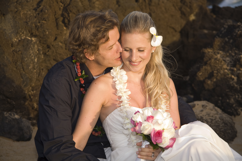groom kisses bride at their Hawaii Weddings