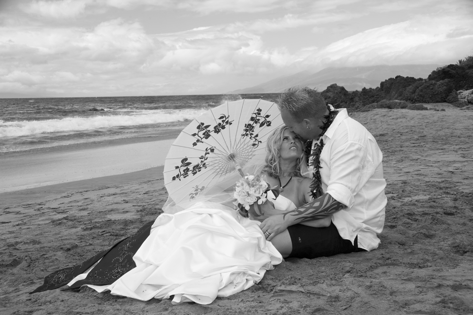 bride with umbrella at Hawaii beach wedding