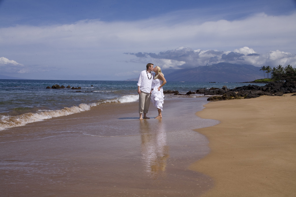 Maui, Hawaii wedding beach at Poolenalena where couple kiss for their photography