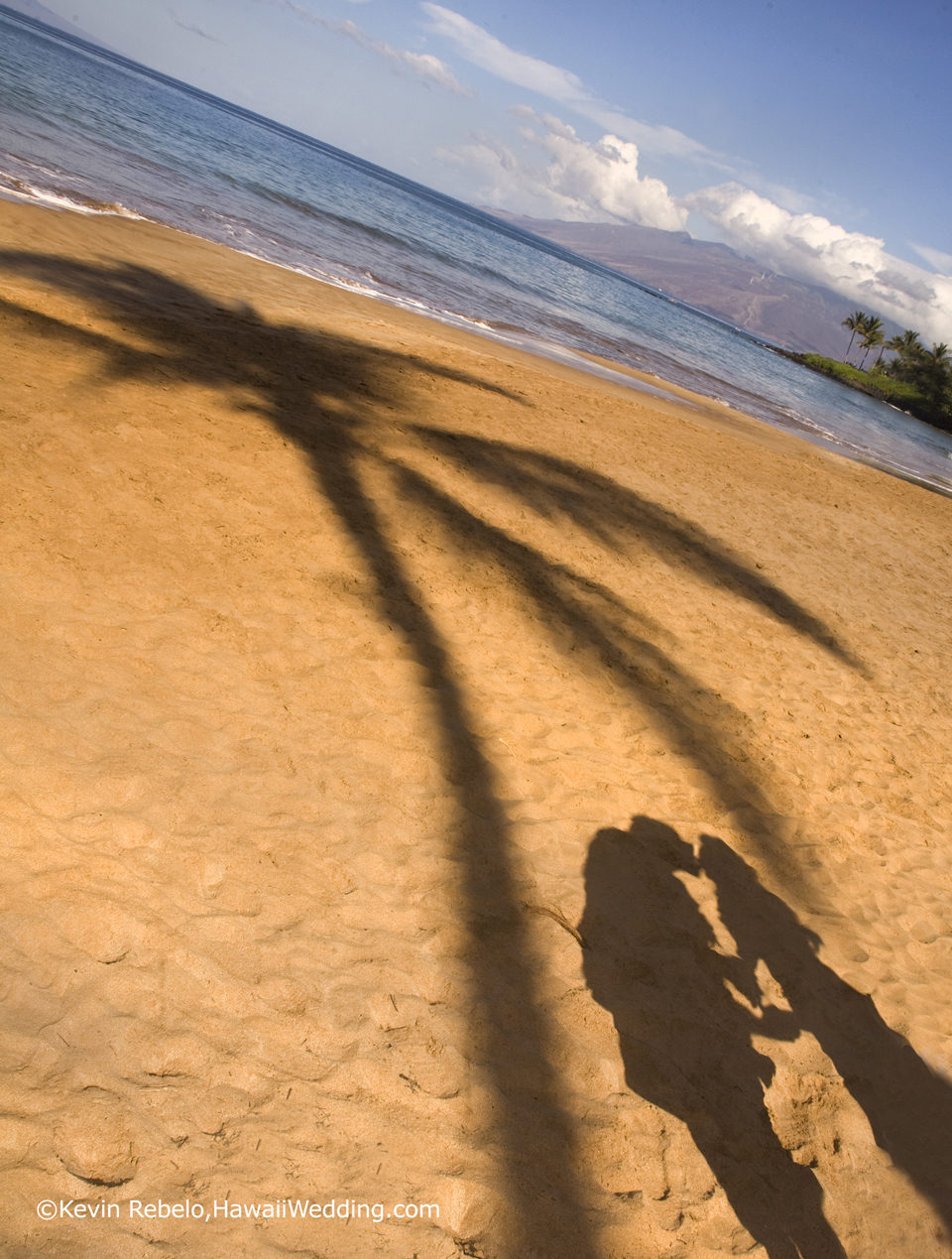 bride and groom shadow on hawaii wedding beach