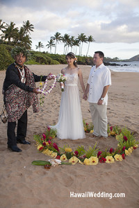 Hawaiian minister performing a beach wedding on Maui